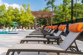 Lounge Chairs With Pillows At The Pool Sundeck